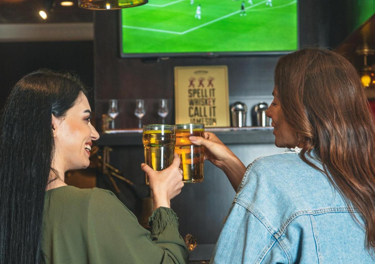 City Centre Rotana Doha Hotel Exterior photo Two women drinking beer