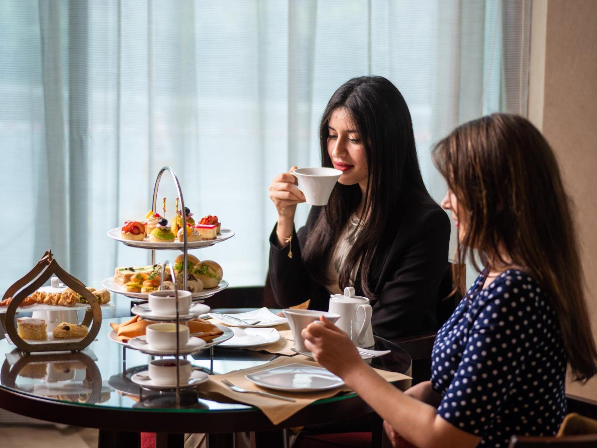 City Centre Rotana Doha Hotel Exterior photo Afternoon tea